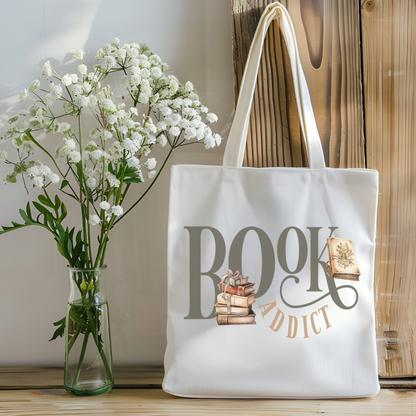 Sac fourre-tout de couleur naturel en coton 15 x 16 pouces de diamètre avec design de livres et l'inscription Book Addict. Pour amateur de lecture et de livres.