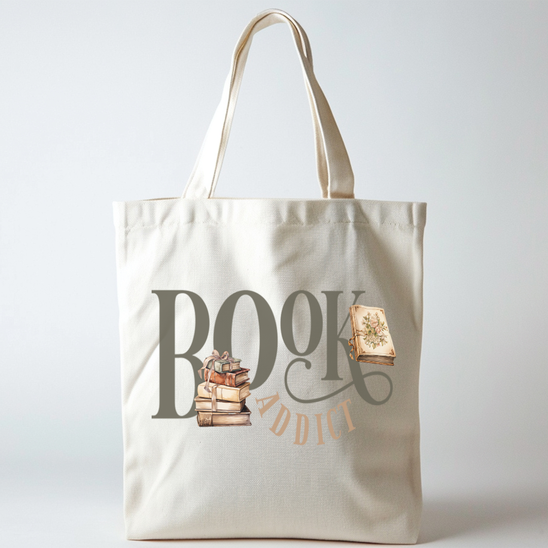 Sac fourre-tout de couleur naturel en coton 15 x 16 pouces de diamètre avec design de livres et l'inscription Book Addict. Pour amateur de lecture et de livres.